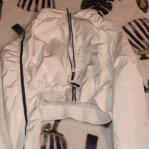 white reflective windbreaker.